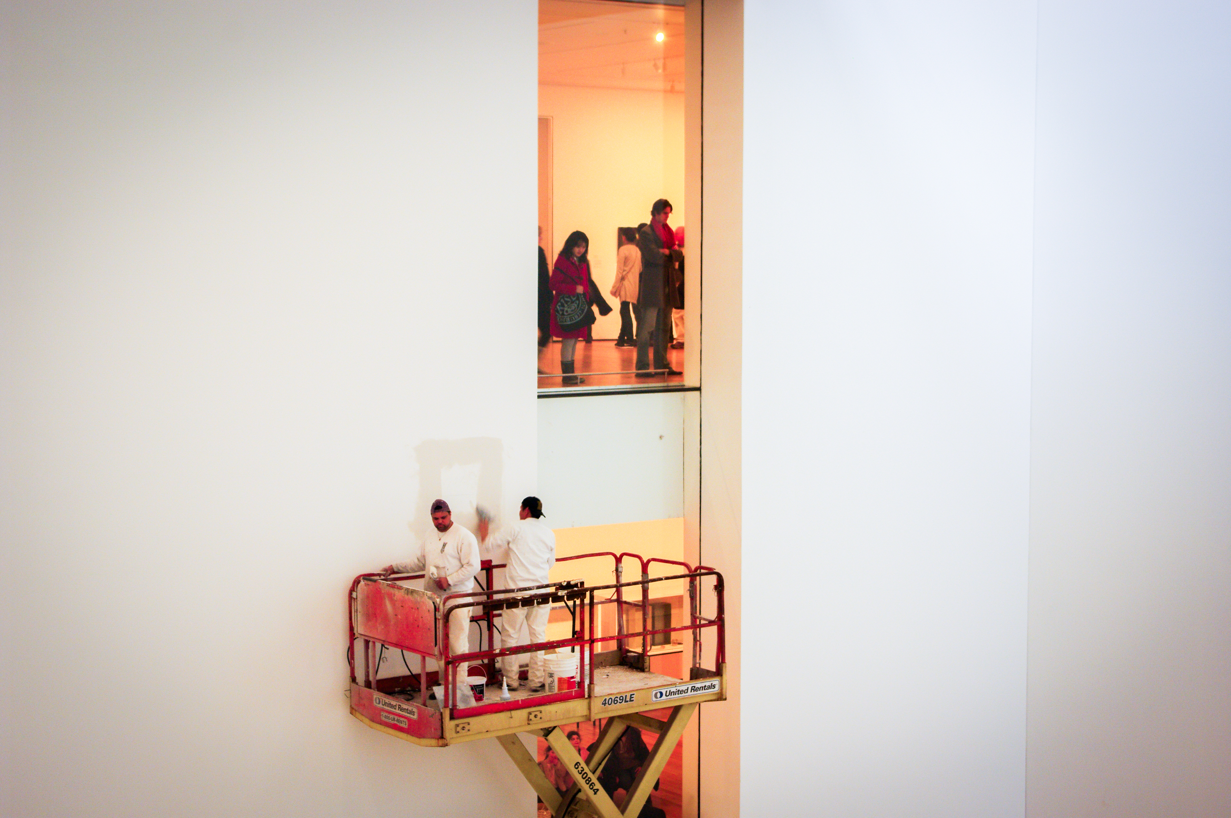 Gallery workers on lift